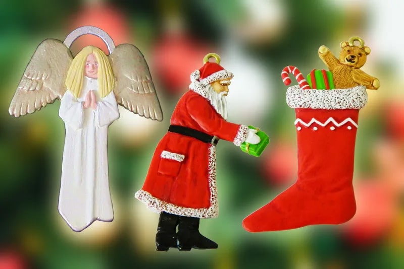 A festive image features three Christmas ornaments: an angel with long blonde hair and white robes, Santa Claus with a green gift, and a red stocking filled with presents and a teddy bear. The background is a blurred mix of green and red colors.