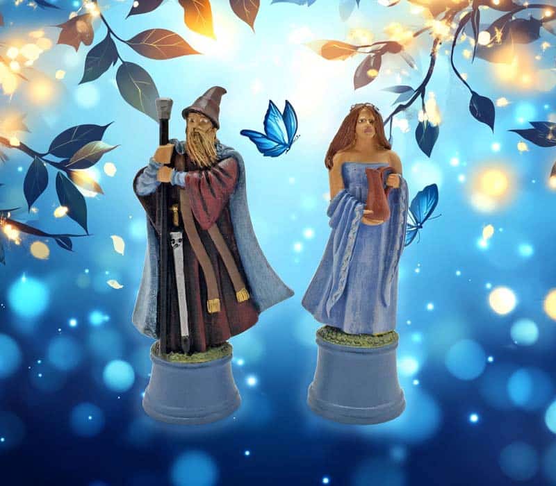 Blue toned image showing two metal miniatures of a Wizard and female sorcerer that are options for November 2024 Promotion Workshops.