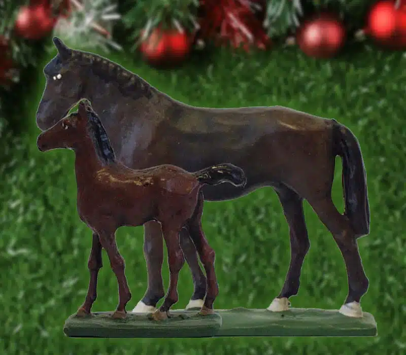 Horse and foal combination of miniatures are the choice for December 2025 workshops. Background is a green field with Christmas decorations on top.